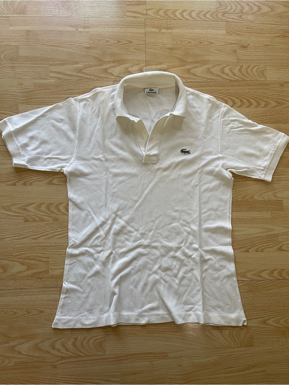 Vintage White Lacoste polo shirt with small stain on the back